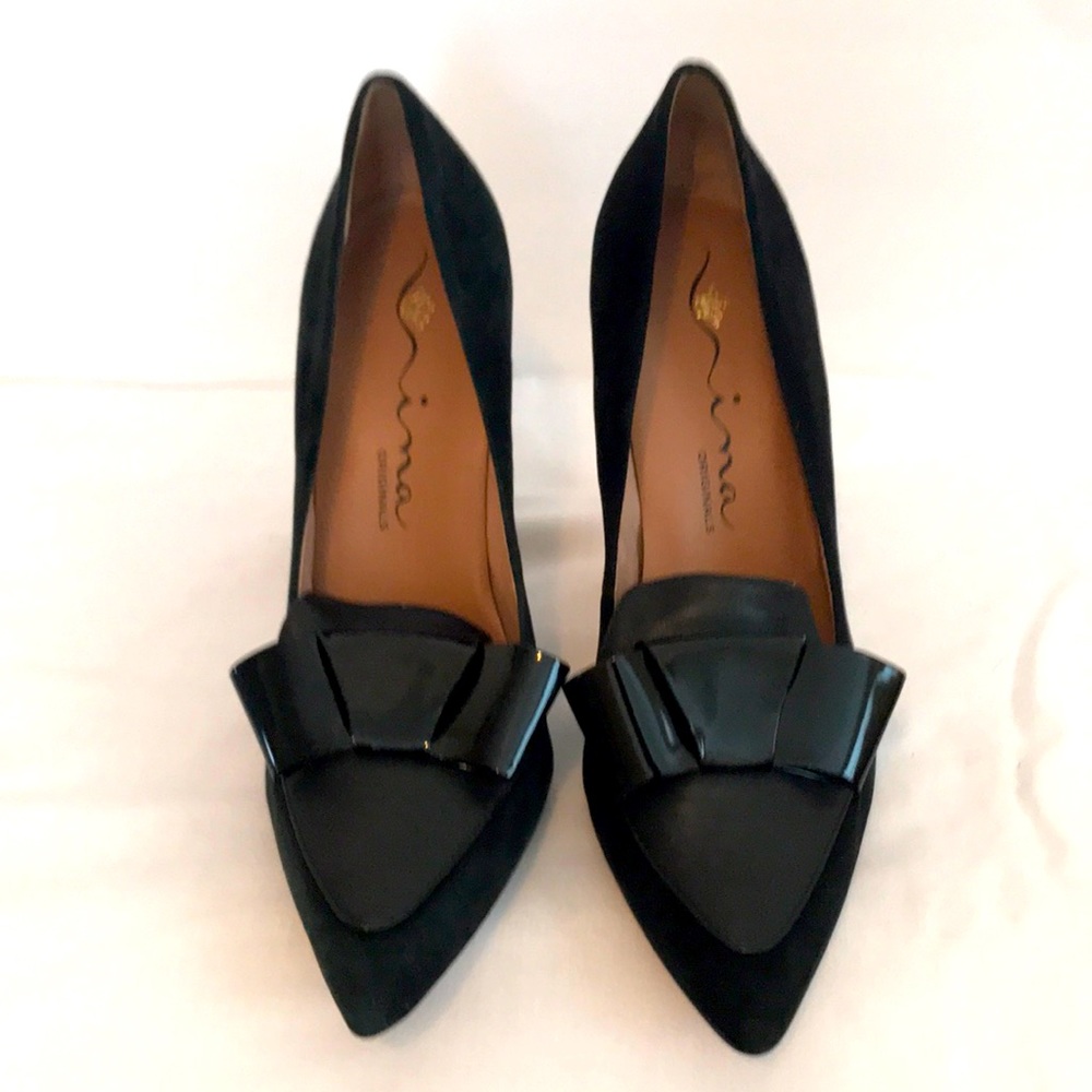 Black suede stilettos with patent leather bow accent by Nina.